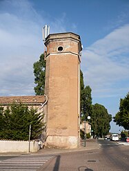 The tower of the FORTEF (Forces et Terres du Fium'orbu) of Migliacciaru, housing a clock and a siren to inform workers of the time, in Prunelli-di-Fiumorbo
