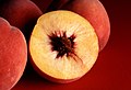 Image 2Autumn Red Peach  4, cross section showing freestone variety