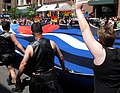 Marchers carrying large leather pride flag, 2008