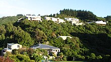 Photo of Raphael House Rudolf Steiner School in Tirohanga, Lower Hutt from the road that runs below.