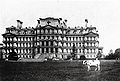 Pauline Wayne, President Taft's pet cow in front of the building