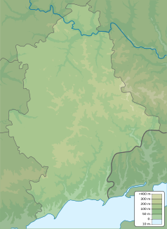 Mapa konturowa obwodu donieckiego, blisko centrum na lewo znajduje się punkt z opisem „miejsce bitwy”