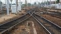 At exit of station (on the left stabling sidings for rolling stock. In the centre lines towards Lille and Paris. On the right locomotive depot.)