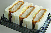 Katsu-sando served as an ekiben aboard a Shinkansen service