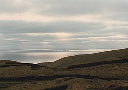 Peat banks on the island with the Mweelaun Islands beyond