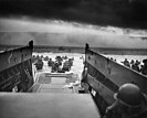 Soldiers wading ashore from landing craft on D-Day