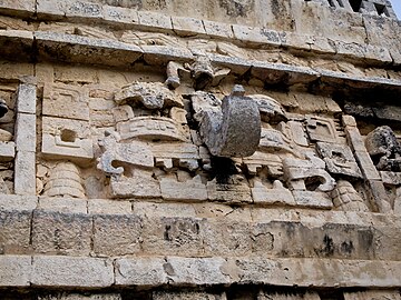 Mosaic mask on the western face of La Iglesia