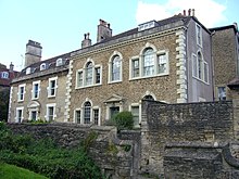 Two-storey houses behind wall