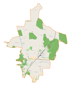 Mapa konturowa gminy Rogów, blisko centrum na dole znajduje się punkt z opisem „Rogów”