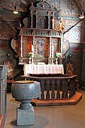 Baptismal font (soapstone) and altar, Røldal Stave Church