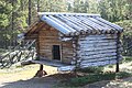 Ájtte, a traditional storage hut made of timber.