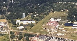 Close-up aerial view showing the Butler Farm Show Grounds (right) on the day of the rally with the building (left) the shooter climbed on