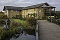 Entrance to the visitors centre at the WWT London Wetland Centre; on the left is the statue of Peter Scott by Nicola Godden