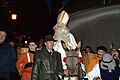 Traditionele rondrit door de stad Fribourg op een ezel; 6 december.