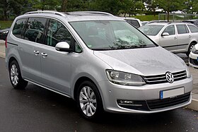 Front three-quarter view of a five-door road car with sliding rear-passenger doors.