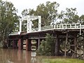 Old North Bourke bridge, in flood, northern side, North Bourke (2021).