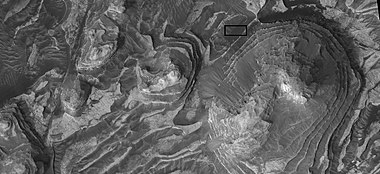 Layers in Firsoff crater with a box showing the size of a football field Picture taken by HiRISE under HiWish program.