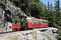 La locomotive à vapeur Lieseli du petit train panoramique d'Émosson arrivant au croisement no 1.