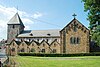 Kerk Saint-Pierre: toren en middenschip dat grenst aan oude delen