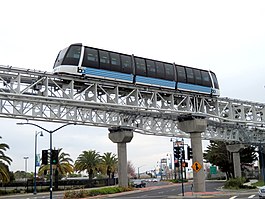 A modern cable car on an elevated track