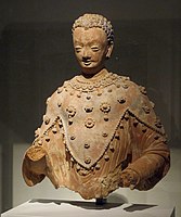 Statue of the Buddha wearing the Iranian three-pointed chamail, Ghorband valley, Fondukistan monastery, circa 700 CE.[14]