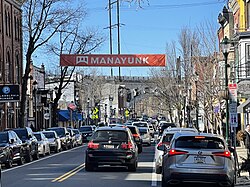 Manayunk Main Street with the Manayunk Bridge in the background