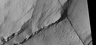 Close view of layers, as seen by HiRISE under HiWish program A ridge cuts across the layers at a right angle.