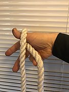 2. The inner rope is pulled back and out using the ring finger.