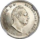 Silver coin showing bust of a man