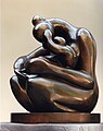 "Mother embracing Child", for Carbonell, depicting in this sculpture a warm embrace or a loving posture, evokes the bond of cultivating treasured affection between mother and child during their lifetime.