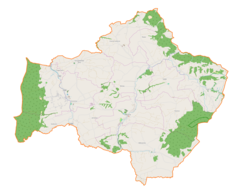 Mapa konturowa gminy Jodłownik, blisko centrum na lewo znajduje się punkt z opisem „Szczyrzyc”