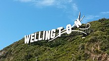 Photo of a large sign on a hill