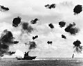 Yorktown is hit on the port side, amidships, by a Japanese Type 91 aerial torpedo during the mid-afternoon attack by planes from the carrier Hiryu.