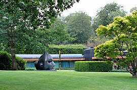 The green garden and the modernist façade of the Louisiana museum, which faces the Øresund sound.