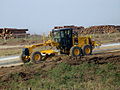 Grader cleaning and leveling