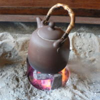 Teapot over hot coals in Taiwan. Photo by David Monniaux.