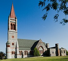 Romanesque church with an orange spire