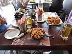 A classic poutine served in a cast-iron skillet.