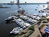 A number of boats in a harbor