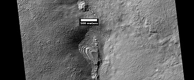 Layered feature probably formed by the erosion of the upper plains unit, as seen by HiRISE under HiWish program.