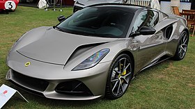 A two-door car with alloy wheels and large vents in the bonnet.