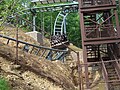 Part of Mystery Mine's back section, preceding the 95 degree drop. The car is exiting the U-turn that was removed prior to the 2021 season.