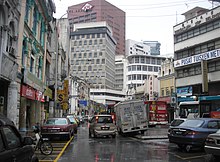 Jalan Tun H S Lee (High Street) in the old town of Kuala Lumpur, featuring a blend of old and new architecture.