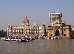 A view of the hotel with the Gateway of India, as seen from the Arabian Sea