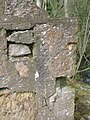 Re-used stones in the gable end wall