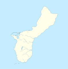 Mapa konturowa Guamu, blisko centrum na prawo u góry znajduje się punkt z opisem „Dededo”
