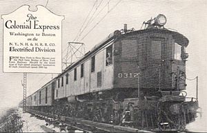 Boxcab locomotive pulling head-end and passenger cars