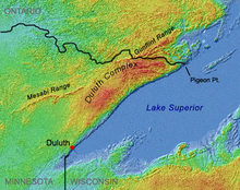 Shaded-relief image showing Duluth Complex arcing from Duluth to Pigeon Point, interrupting and splitting the Mesabi and Gunflint ranges.