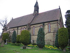 View of a plain church, with a bell-tower above the crossing