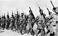 Soldiers of the New Zealand Expeditionary Force, 20th Battalion, C Company marching in Baggush, Egypt, September 1941.